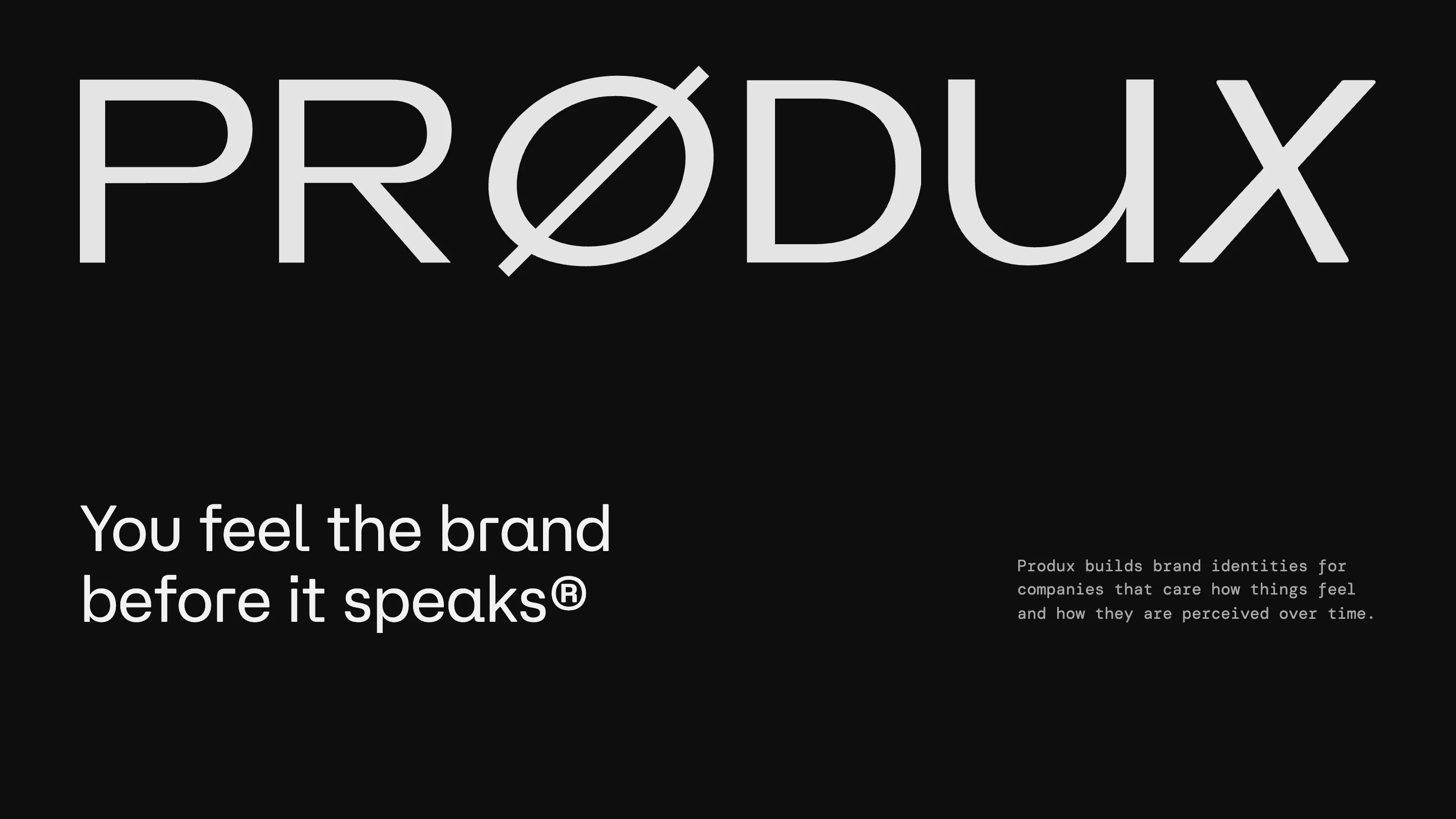 The Prødux homepage: a large PRØDUX wordmark and the line 'You feel the brand before it speaks' in white on near-black.
