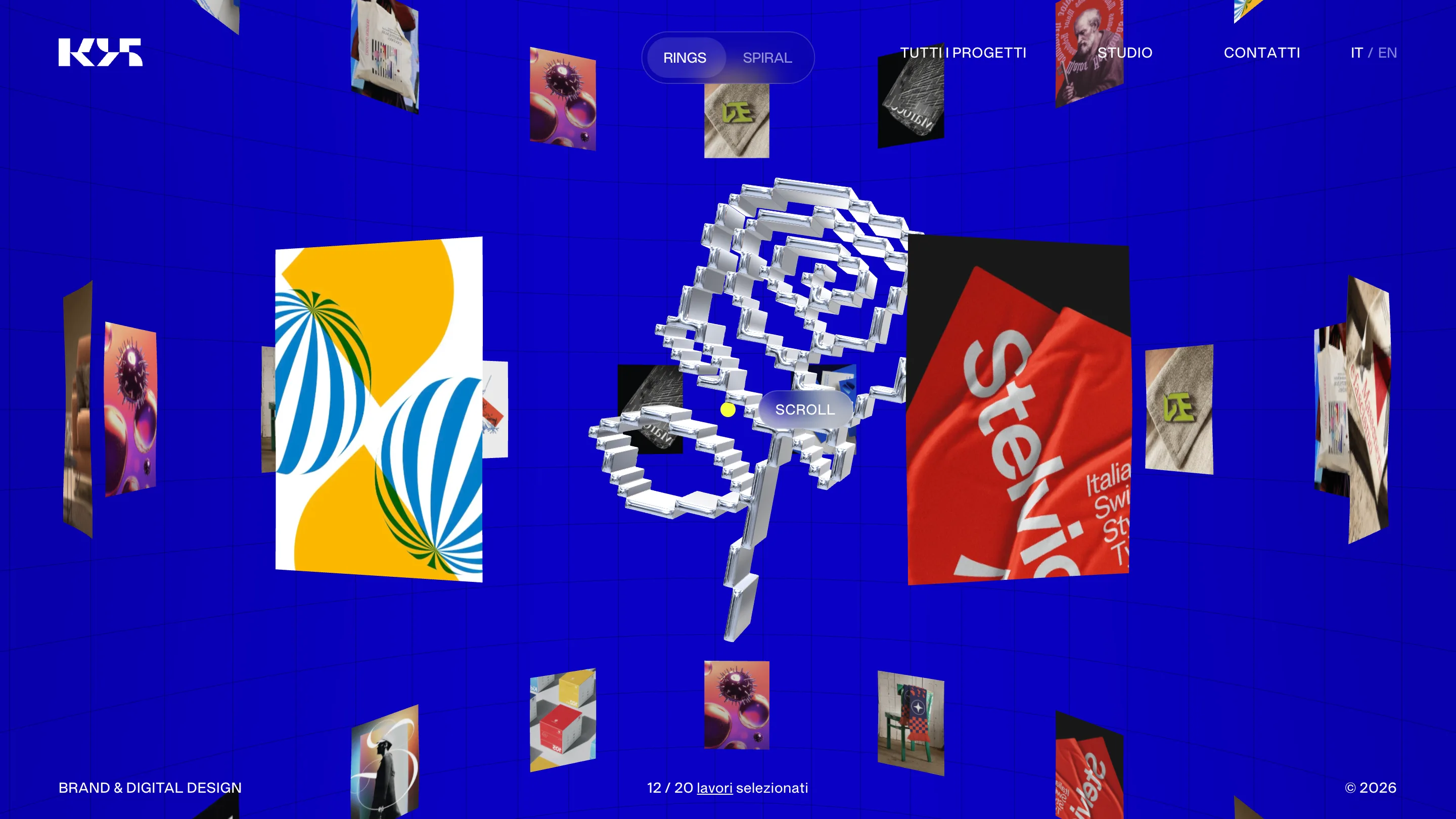 Studio K95 homepage: project thumbnails floating in 3D on an electric blue field, with a chrome pixelated object in the center and a RINGS/SPIRAL toggle