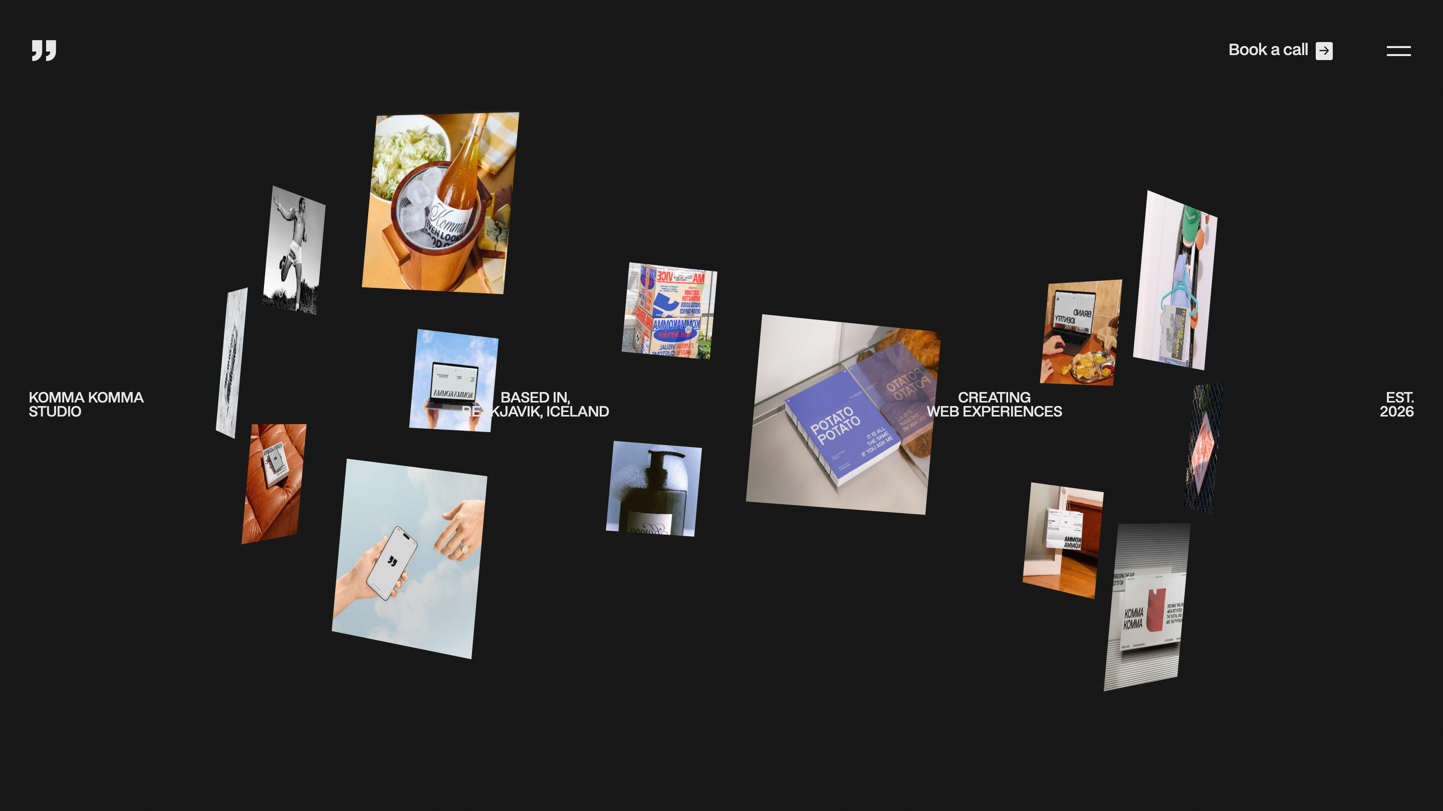 The Komma Komma studio page: roughly twenty project photographs scattered and tilted in 3D space on a black background, with small labels reading based in Reykjavik Iceland and creating web experiences