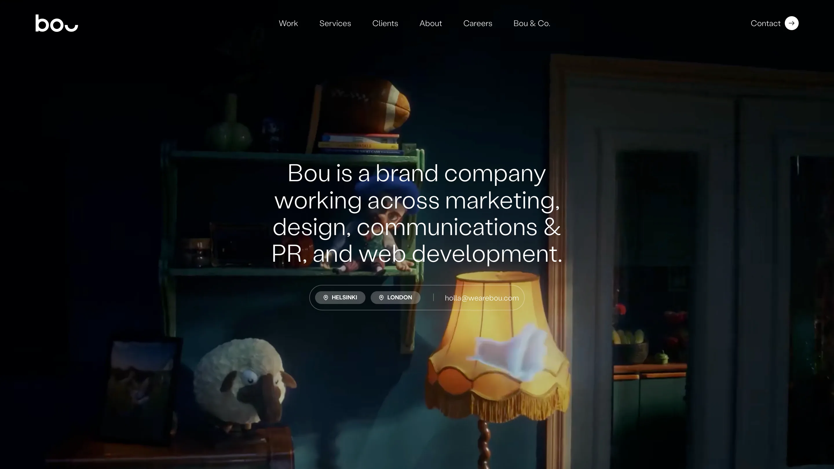 Bou's home page: a centred white headline describing the brand company over a dark stop-motion film of a puppet, a lamp and a toy sheep