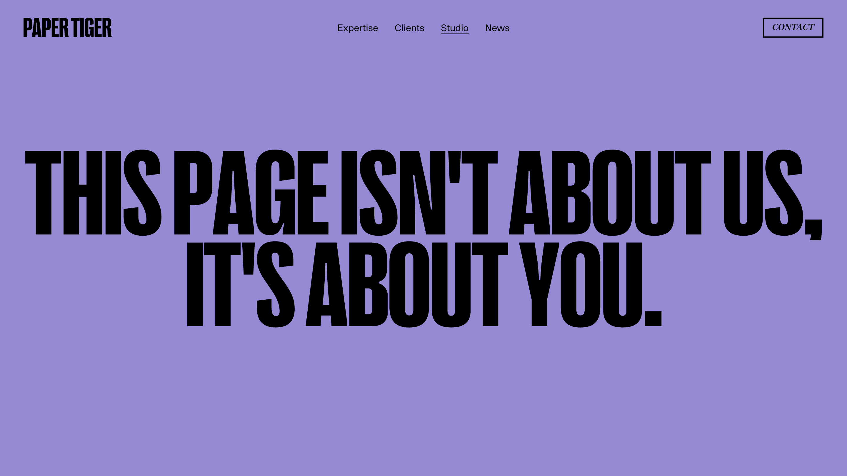 Paper Tiger's Studio page: one headline set enormous in black condensed type reading THIS PAGE ISN'T ABOUT US, IT'S ABOUT YOU, on a flat lavender background